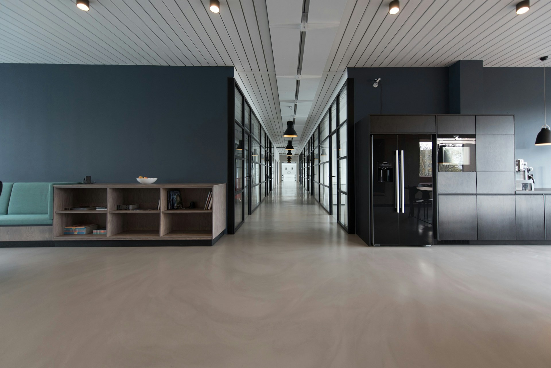 Modern office workspace at Toa Payoh HDB Hub with blueprint studio meeting area